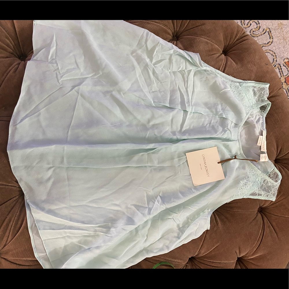 Size M, 100% silk light blue sleeveless top.